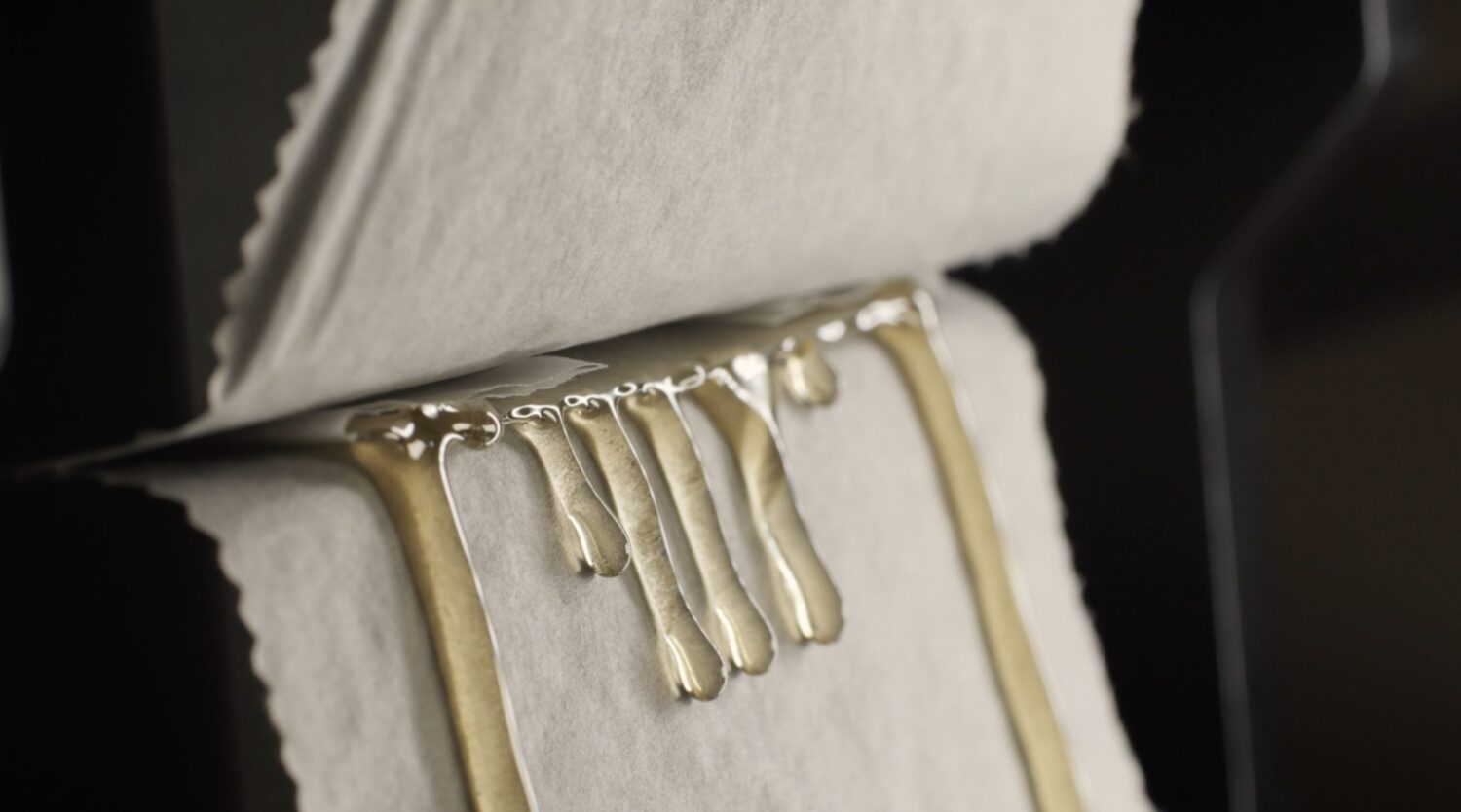 Golden live hash rosin dripping during solventless pressing